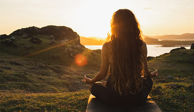 spiritual direction woman meditating sunset