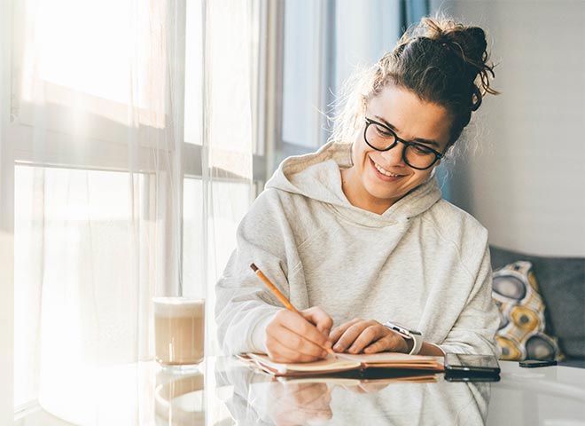 writing coaching woman writing in journal